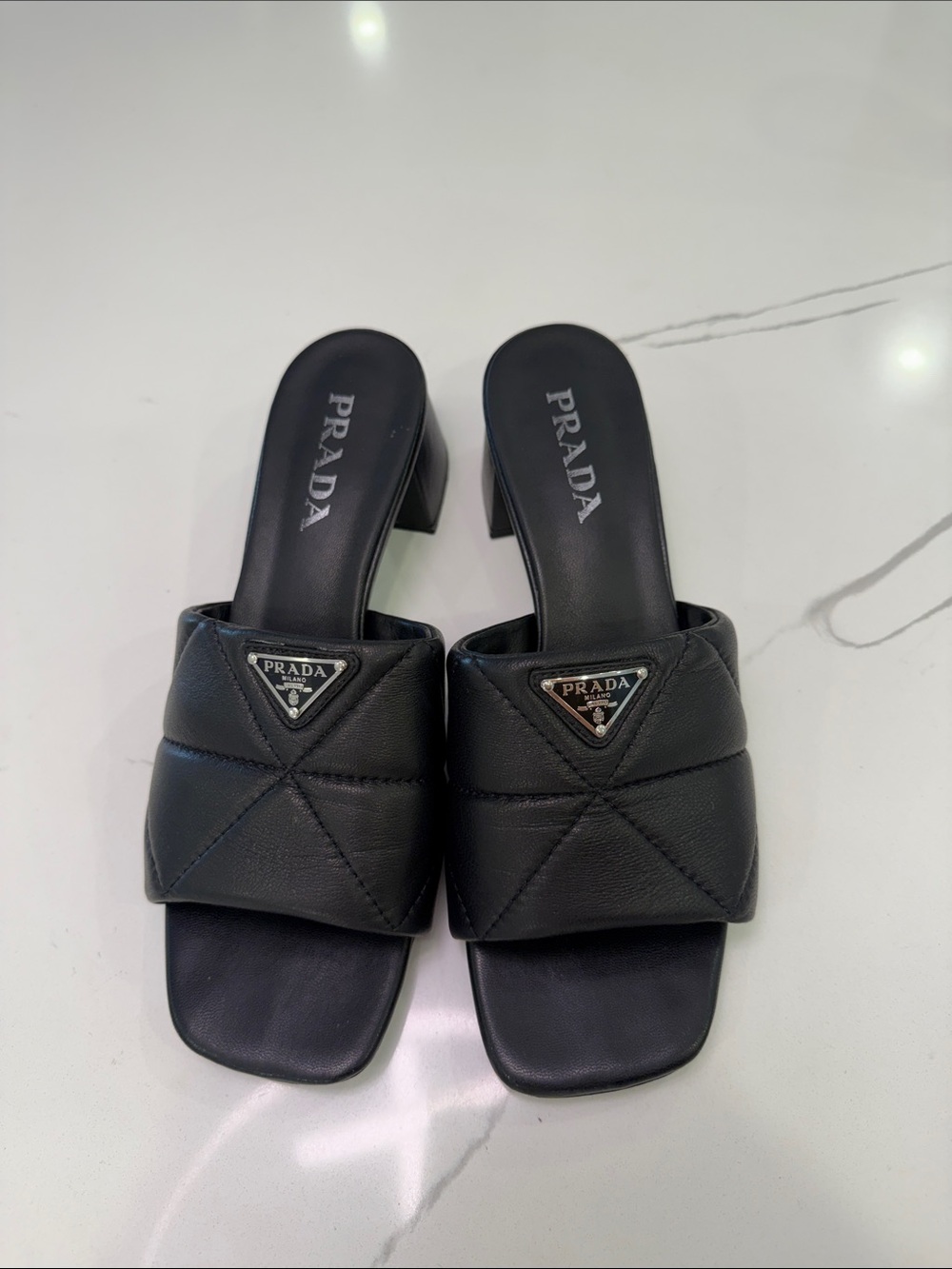 Black Quilted Leather Slide Mules with Logo Plaque